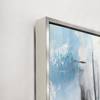 Abstract giclee canvas painting with blue, white, and black strokes, framed in a sleek silver floater.