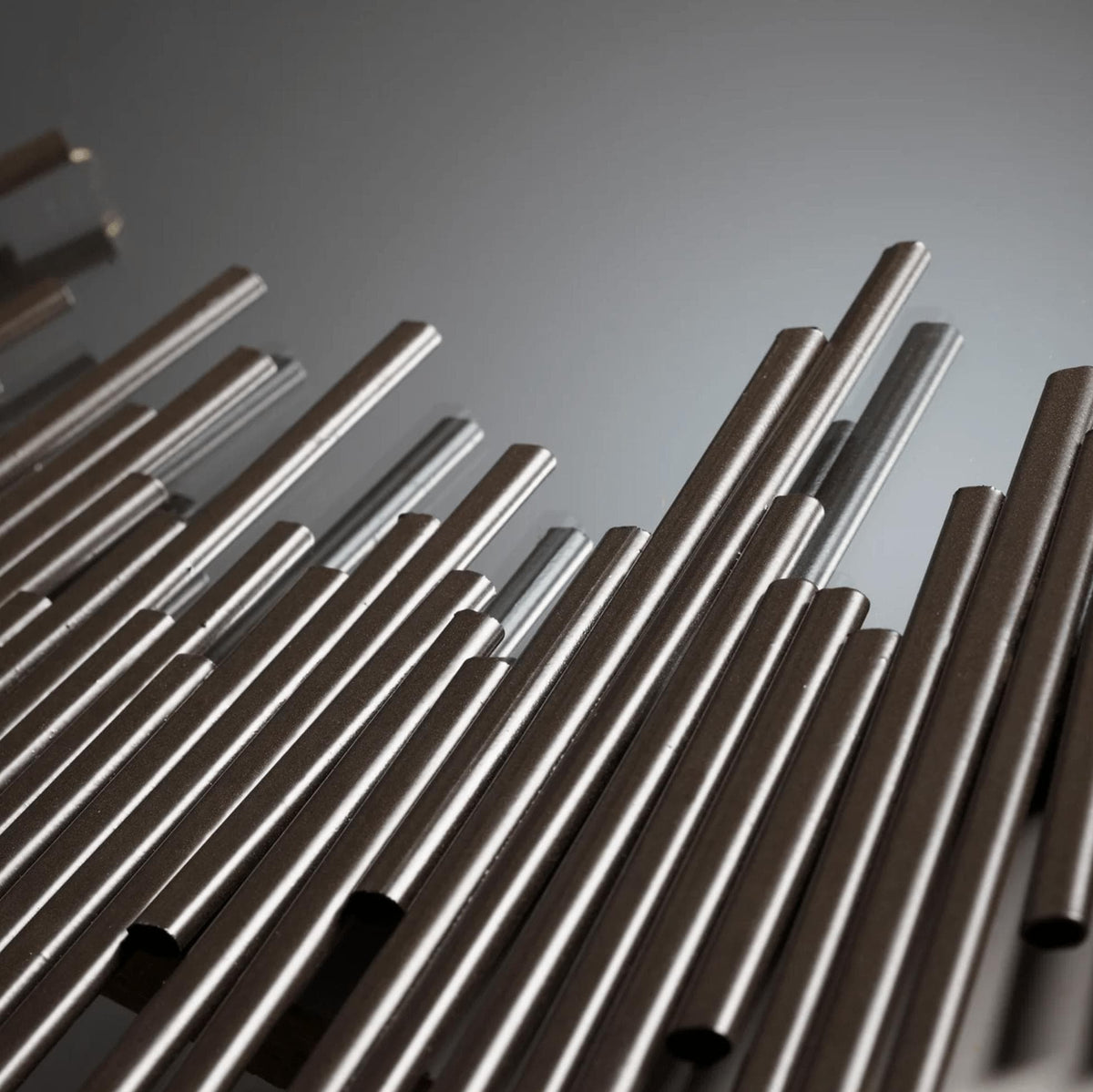 Borealis Graphite Mirror: Modern geometric design with thin iron strips forming a unique ring.
