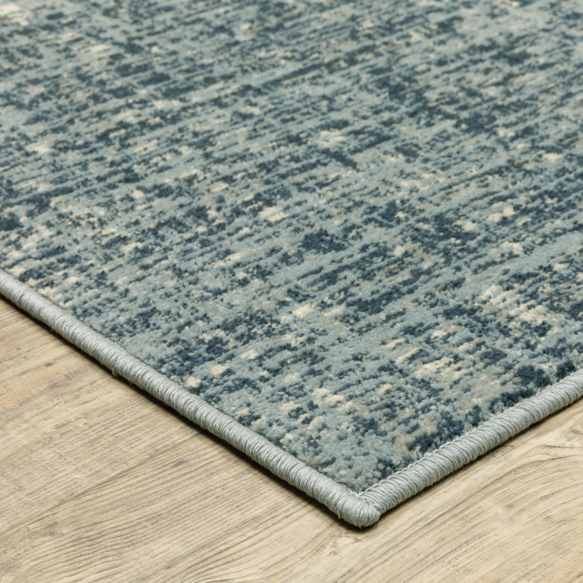 Branson Blue Abstract Rug, power-loomed polypropylene with textured tri-color yarn, modern design.