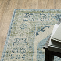 Branson Blue & Beige Traditional Rug with intricate patterns on a light wood floor.