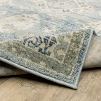 Branson Blue & Beige Traditional Rug, power-loomed polypropylene with classic design, curled corner showing woven back.