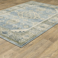 Branson Blue & Beige Traditional Rug, power-loomed polypropylene with classic patterns on a wood floor.