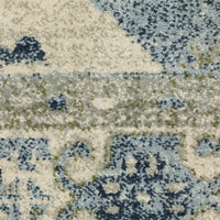 Close-up of a Branson Blue & Beige Traditional Rug with soft polypropylene fibers and abstract patterns.