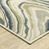 Branson Ivory & Blue Abstract Rug, power-loomed polypropylene with swirling navy, soft blue, moss green, and neutral tones.