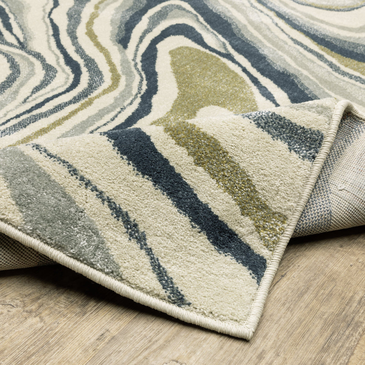 Branson Ivory & Blue Abstract Rug, power-loomed polypropylene with navy, soft blue, moss green, and neutral tones.