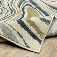 Branson Ivory & Blue Abstract Rug, power-loomed polypropylene with navy, soft blue, moss green, and neutral tones.