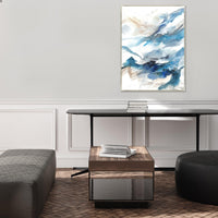 Abstract giclee canvas painting with blue, white, and beige brushstrokes, framed in a modern luxury interior.