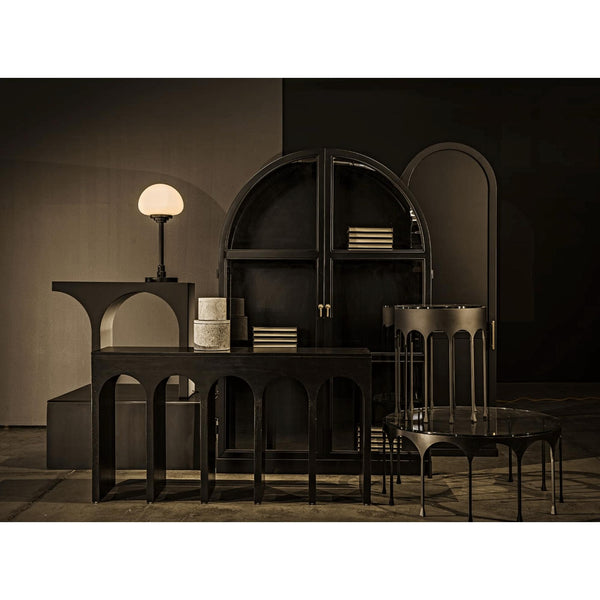 Dark mahogany Bridge Console Table with arched legs, 59"W, in a modern, minimalist setting.