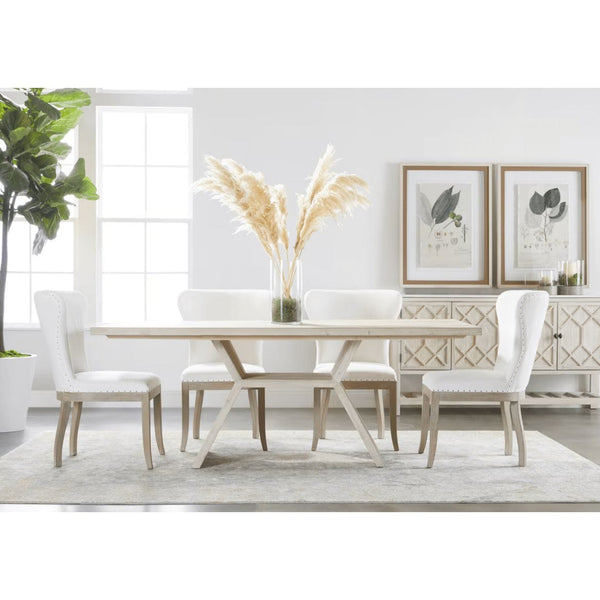 Bridge Dining Table: Reclaimed wood with white wash finish, angular pedestal base, surrounded by white upholstered chairs.