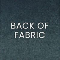 Close-up of the dark teal polyester fabric back of the Brix Haze Throw Pillow, showing its texture.