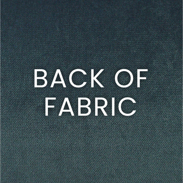 Close-up of the dark teal polyester fabric back of the Brix Haze Throw Pillow, showing its texture.