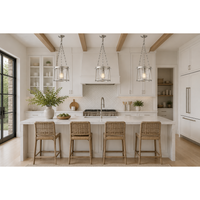 Modern kitchen with white island, bar stools, and pendant lights.