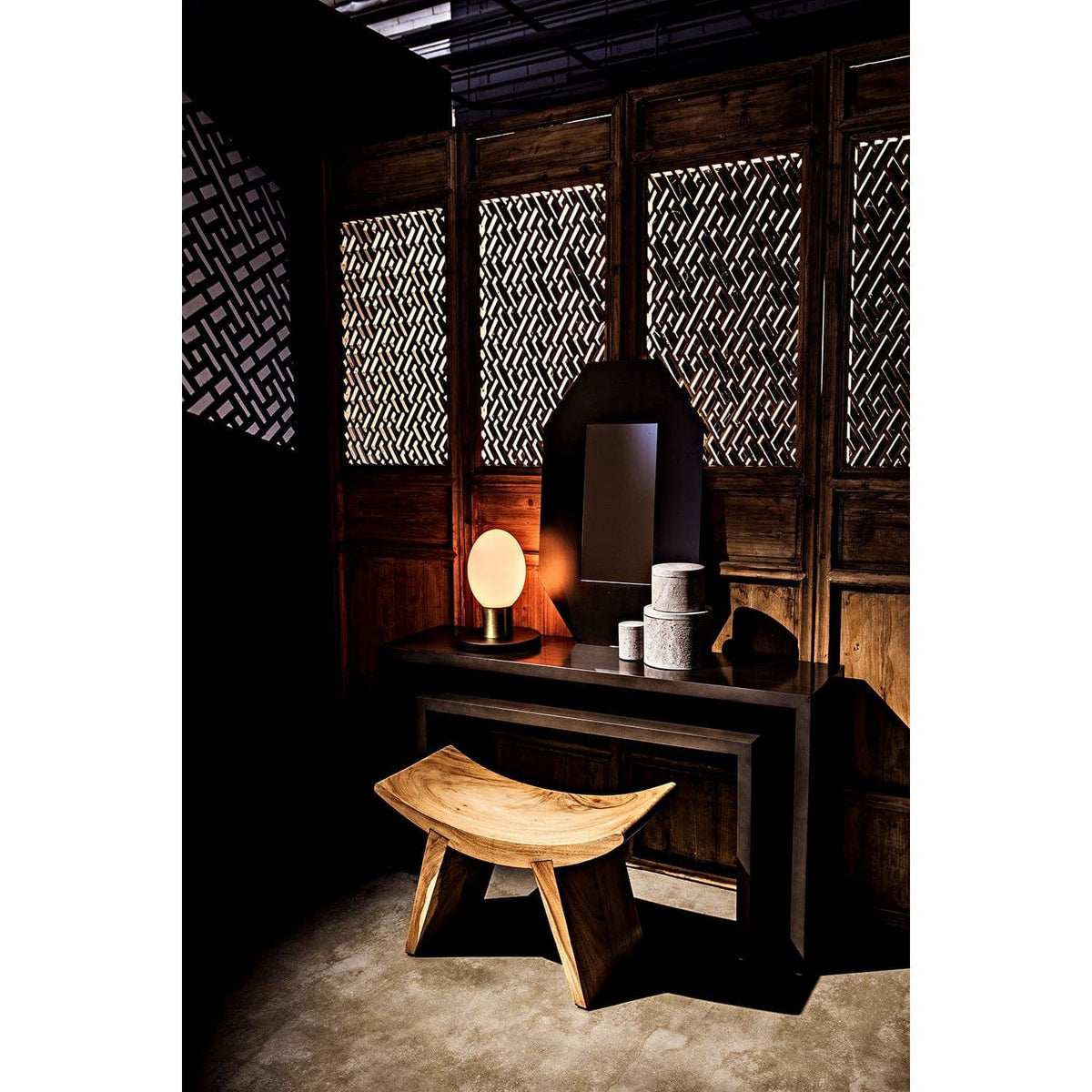Caine Pale Black Mahogany Console: handcrafted, contemporary dark wood console with a pale finish, featuring a mirror and lamp.