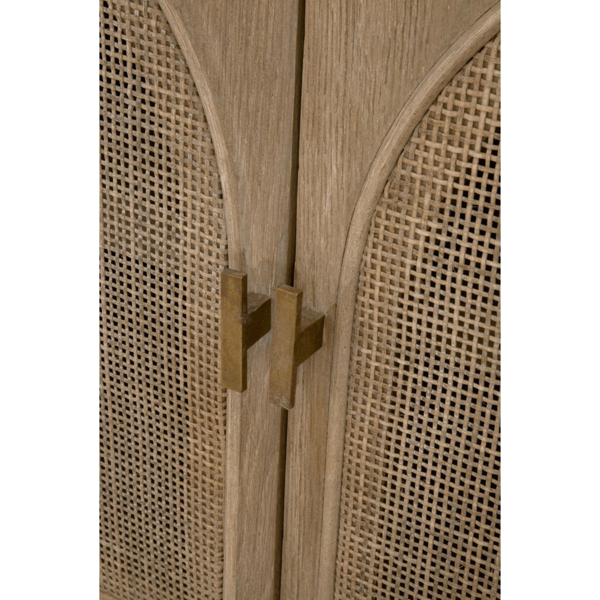 Close-up of Callie Gray Cane Media Cabinet doors with smoke gray oak and cane, featuring brass handles.
