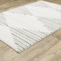 Cambria Beige & Multi Casual Rug, soft polypropylene, carved geometric design with neutral and subtle blue/mint stripes.