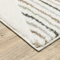 Cambria Beige & Multi Casual Rug, soft polypropylene, power-loomed with carved texture, on wood floor.