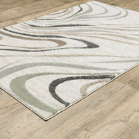 Cambria Beige Multi-Colored Contemporary Rug with swirling neutral, pale blue, and mint polypropylene fibers.