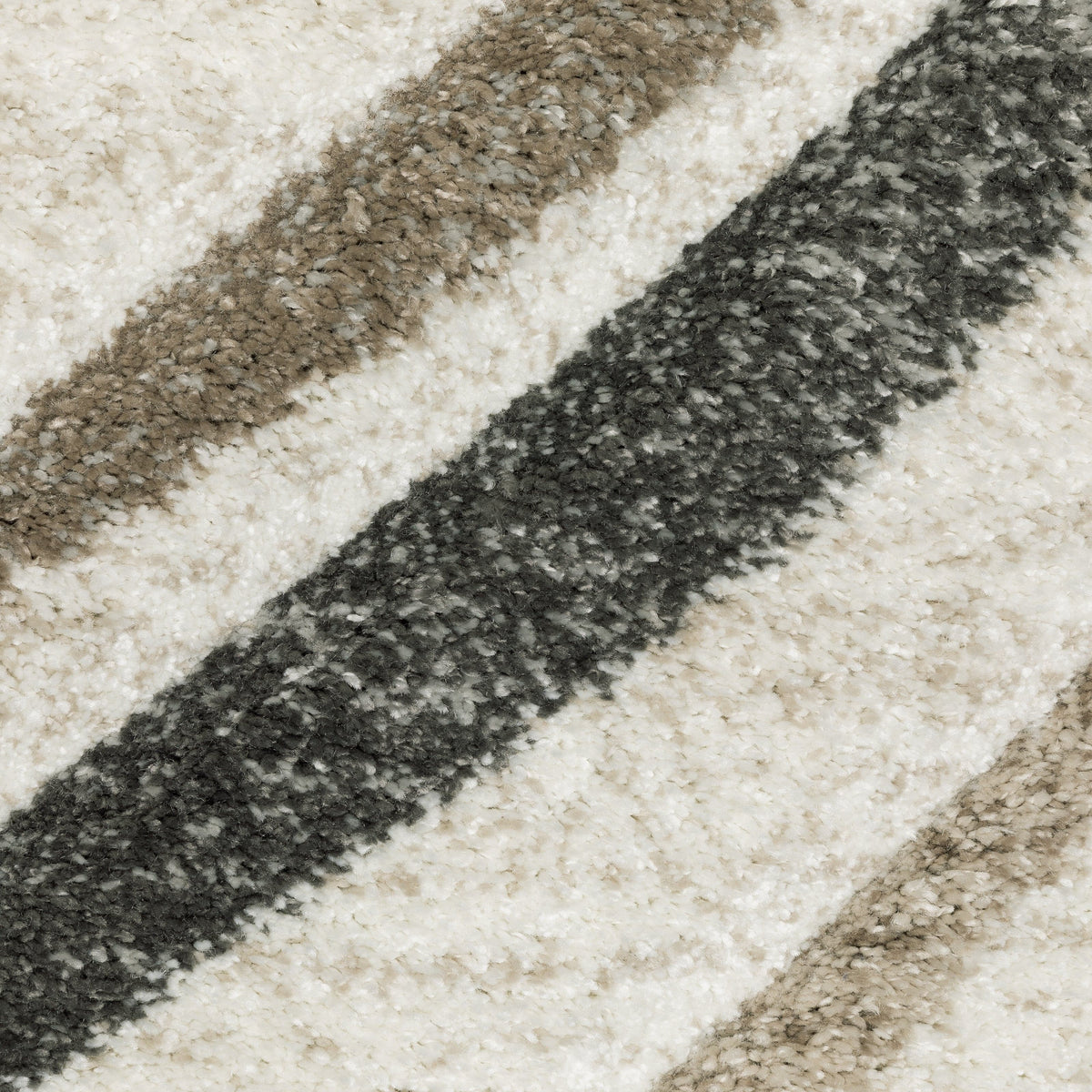 Close-up of a Cambria Beige Multi-Colored Contemporary Rug with diagonal stripes in beige, brown, and dark gray polypropylene.