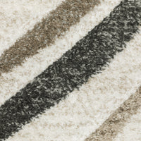 Close-up of a Cambria Beige Multi-Colored Contemporary Rug with diagonal stripes in beige, brown, and dark gray polypropylene.