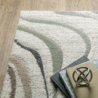 Cambria beige multi-colored contemporary polypropylene rug with wavy neutral, blue, and mint lines.