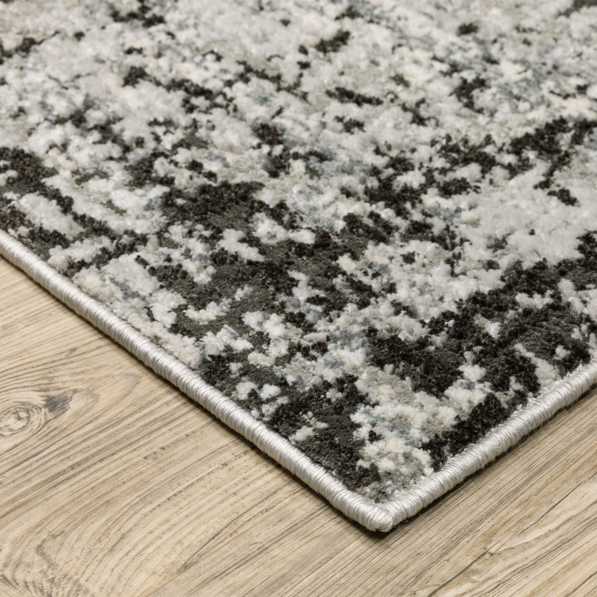 Caravan Grey & Black Contemporary Rug with abstract pattern, textured polyester yarns, and multi-level surface.