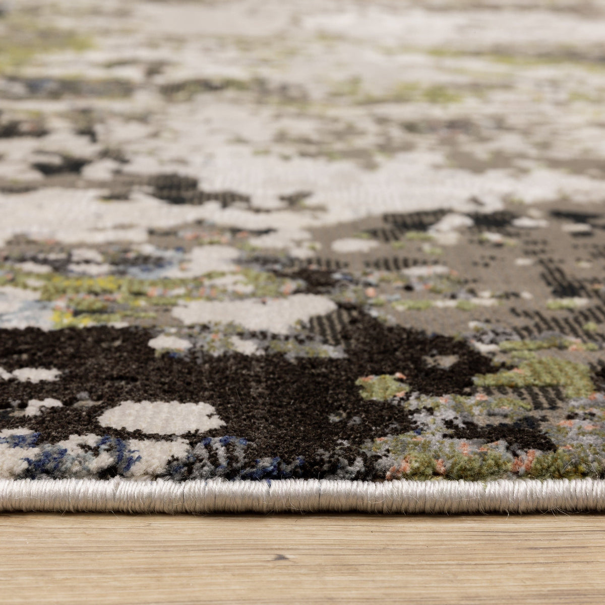 Caravan Grey & Moss Green Contemporary Rug with textured, multi-level polyester surface and natural-inspired colors.