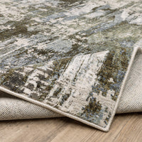 Caravan Moss Green & Blue Contemporary Rug with textured, multi-level polyester surface and woven backing.