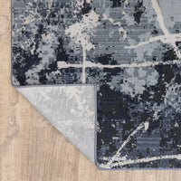 Caravan Multi-Blue Contemporary Rug with textured, multi-level surface and abstract design, showing woven polyester back.