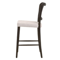 Carly Matte Brown Cane Counter Stool with bisque upholstered seat and curved back.