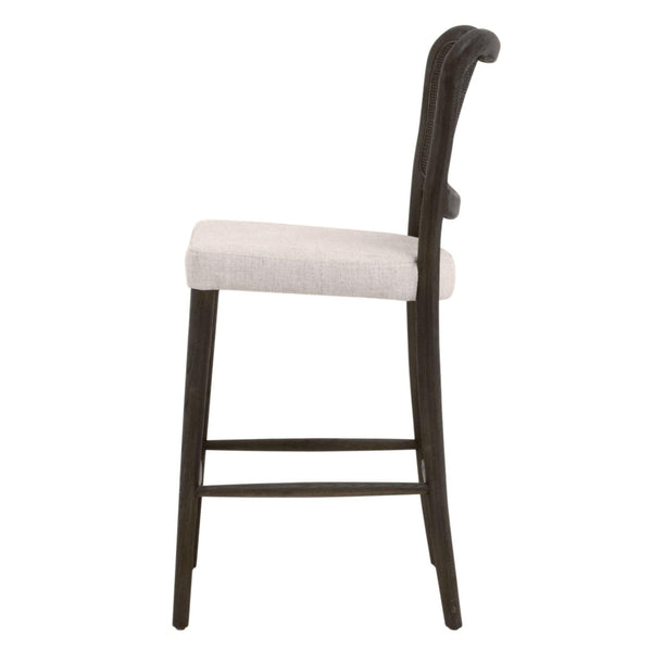 Carly Matte Brown Cane Counter Stool with bisque upholstered seat and curved back.