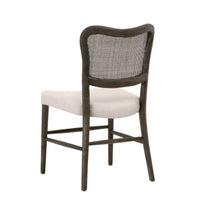 Carly Matte Brown Cane Dining Chair with dark oak frame and light fabric seat.