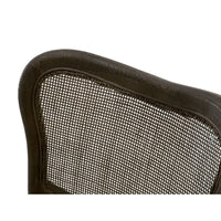 Close-up of Carly Matte Brown Cane Dining Chair back, showing dark oak wood frame and woven cane.