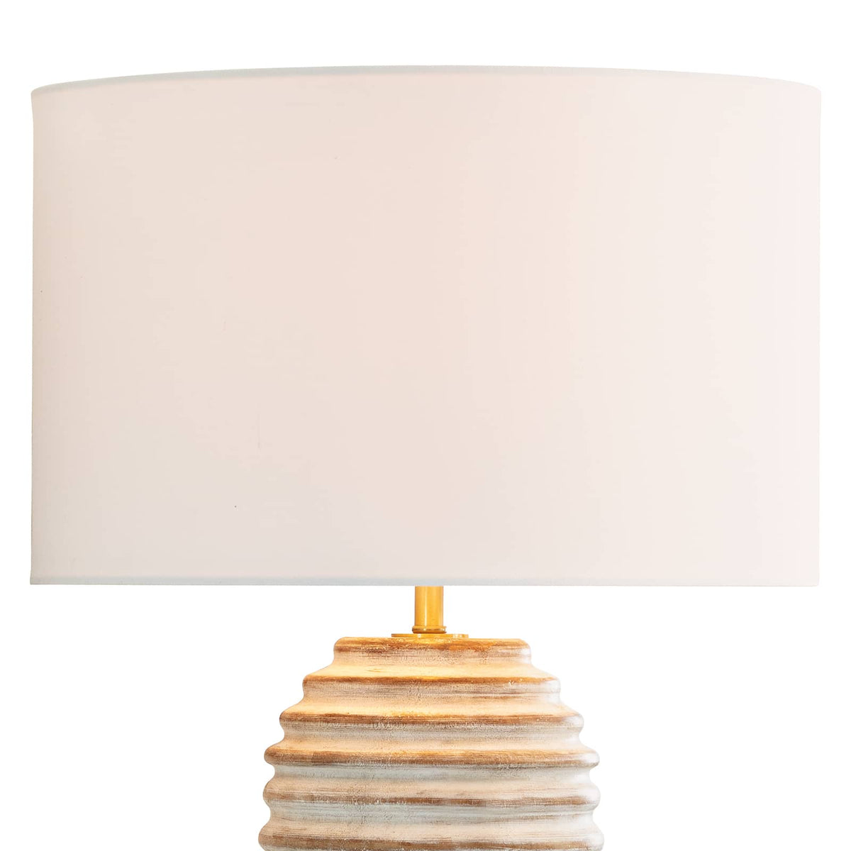 Carmel Wood Table Lamp with a white-washed, distressed wood body, carved ridges, and a large white drum shade.