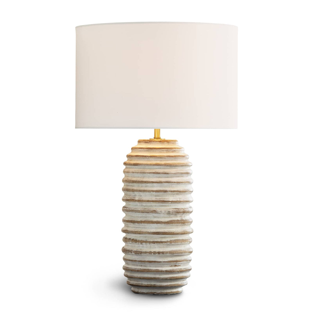 Carmel Wood Table Lamp with distressed white-washed, carved wood body, drum shade, and brass finial.