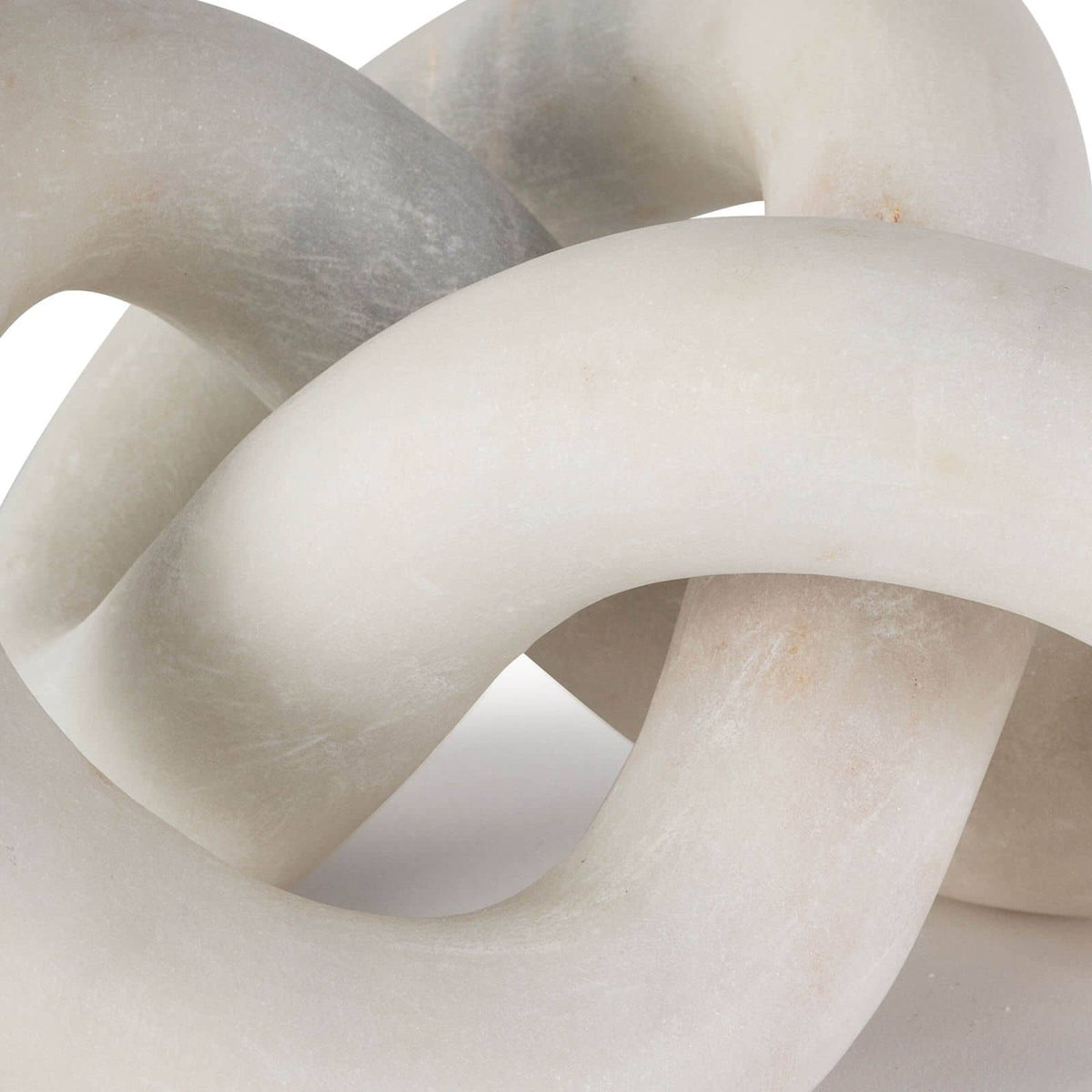 Abstract Cassius marble decorative table sculpture, hand-carved, flowing singular form, light and dark gray tones.