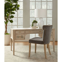 Celina Dark Dove Velvet Dining Chair with sculpted wingback design and dark gray velvet upholstery.