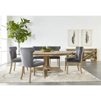 Dark dove velvet dining chairs with wingback design around a rustic wood table.