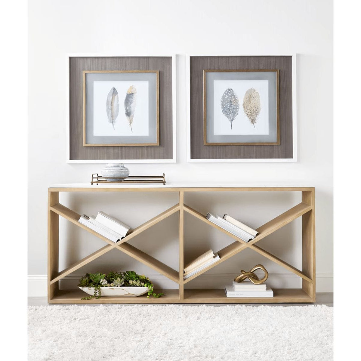 Smoke gray oak console table with white quartz top and geometric X-shaped shelving.
