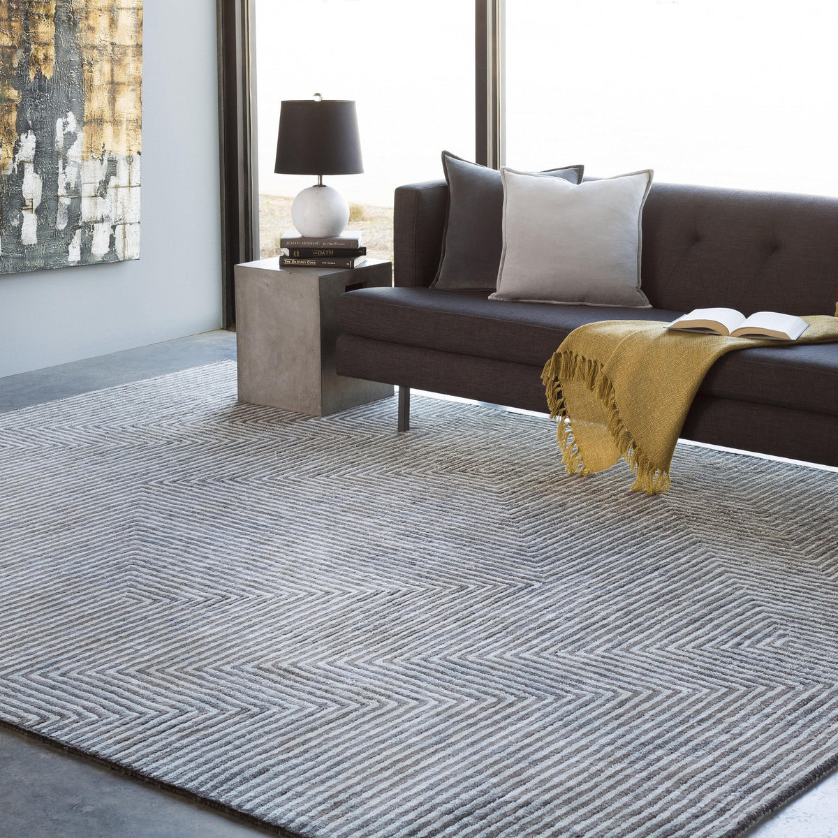 Charcoal and light grey striped viscose rug with a modern hand-tufted zigzag design.