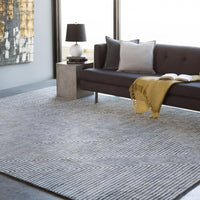 Charcoal and light grey striped viscose rug with a modern hand-tufted zigzag design.