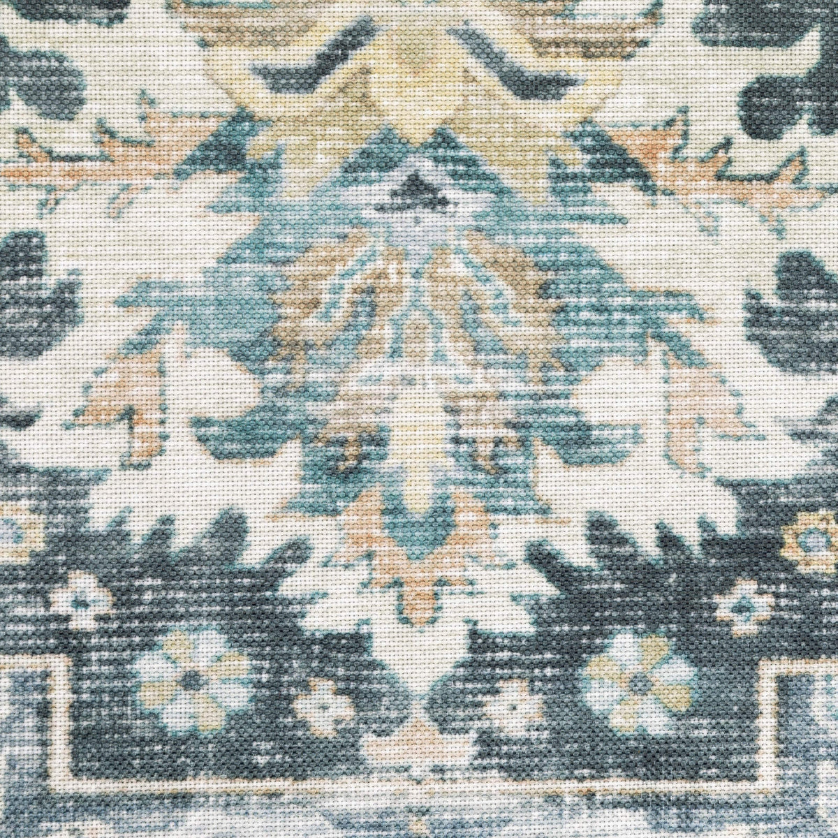 Close-up of a Charleston Blue & Ivory washable polyester rug with distressed traditional design.