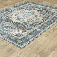 Charleston Blue & Ivory washable polyester rug with distressed traditional design on wood floor.