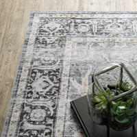 Charleston Charcoal & Grey Washable Rug with intricate medallion design on light wood floor.