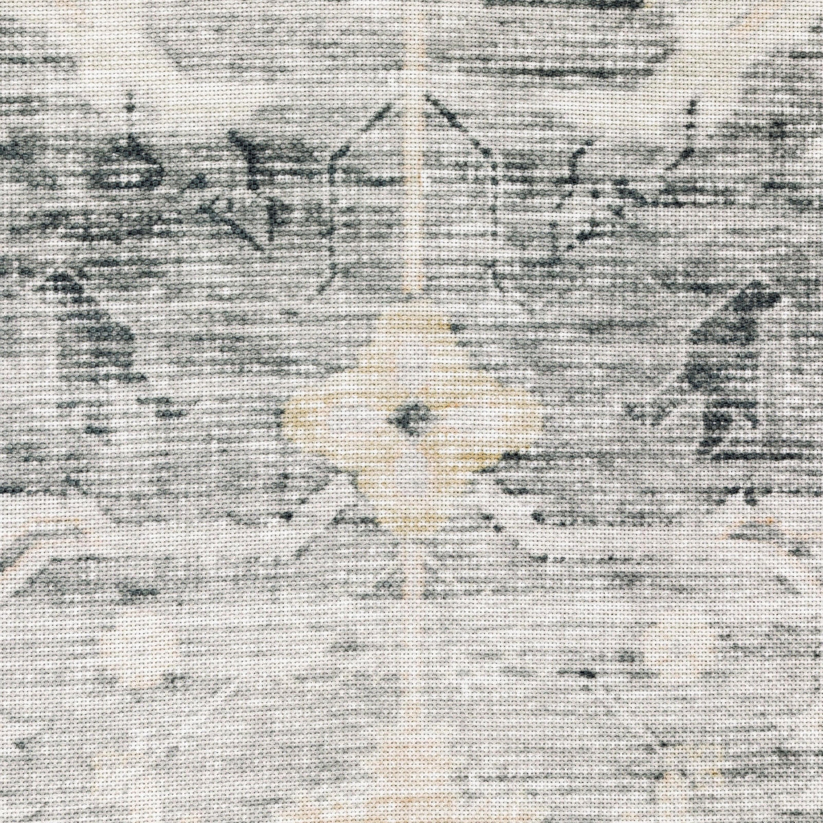 Close-up of a Charleston Charcoal & Grey Washable Rug with a subtle distressed pattern and light yellow accents.