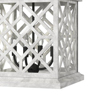 White Chatham Wood Lantern with a lattice pattern and black iron candelabra lights.