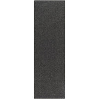 Charcoal gray braided polypropylene outdoor rug with a durable, no-pile texture.