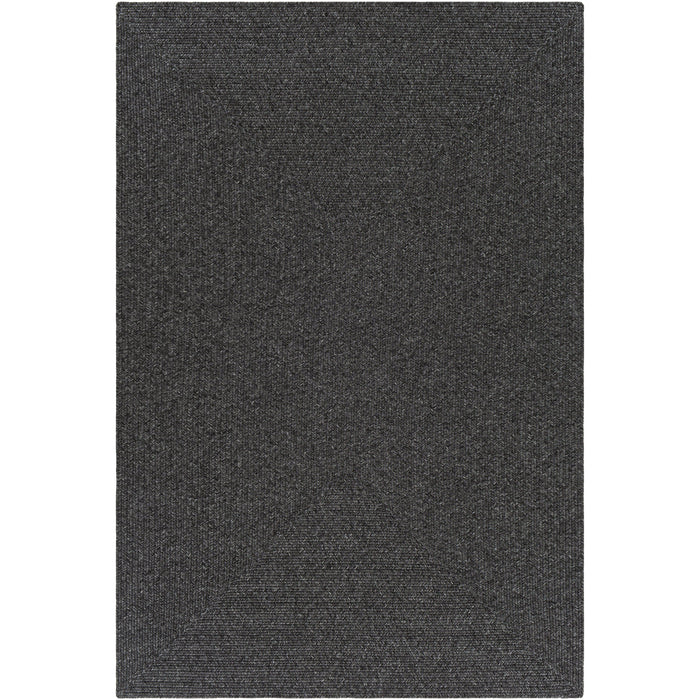 Charcoal gray braided polypropylene outdoor rug with no pile, perfect for coastal-inspired decor.