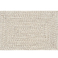 Cream, charcoal, and brown braided polypropylene outdoor rug with no pile.