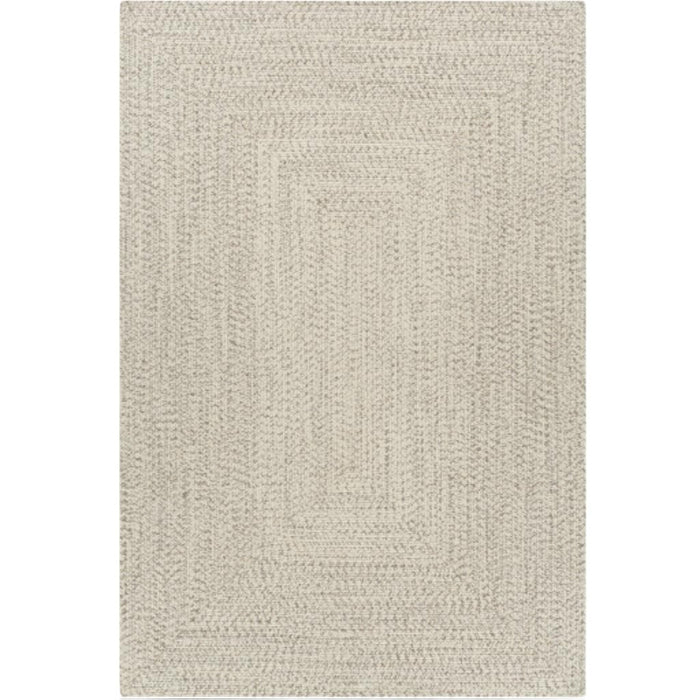 Cream braided polypropylene outdoor rug with a rectangular design.