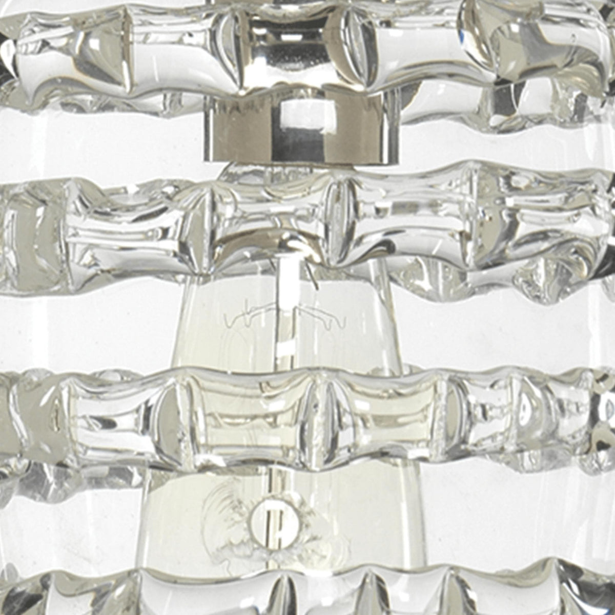 Clear glass round ribbon pendant light with nickel hardware and visible bulb.